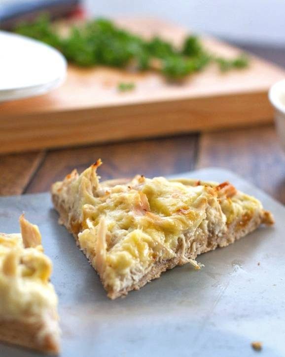 Chicken Alfredo pizza slice.