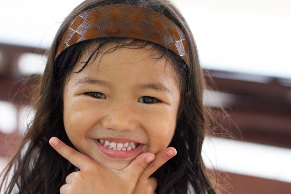 Little girl smiling.