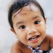 Young girl looking at camera.