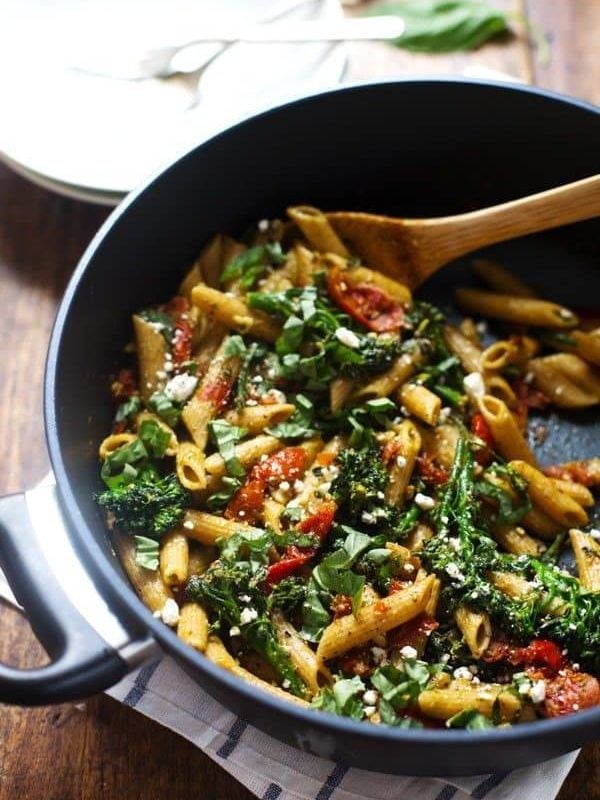 20 Minute Lemon Pesto Penne - baby broccoli, oven roasted tomatoes, pesto, fresh lemon, feta, and basil. My husband says it's his new favorite. | pinchofyum.com