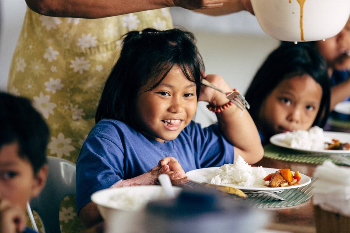 Children eating at a table.