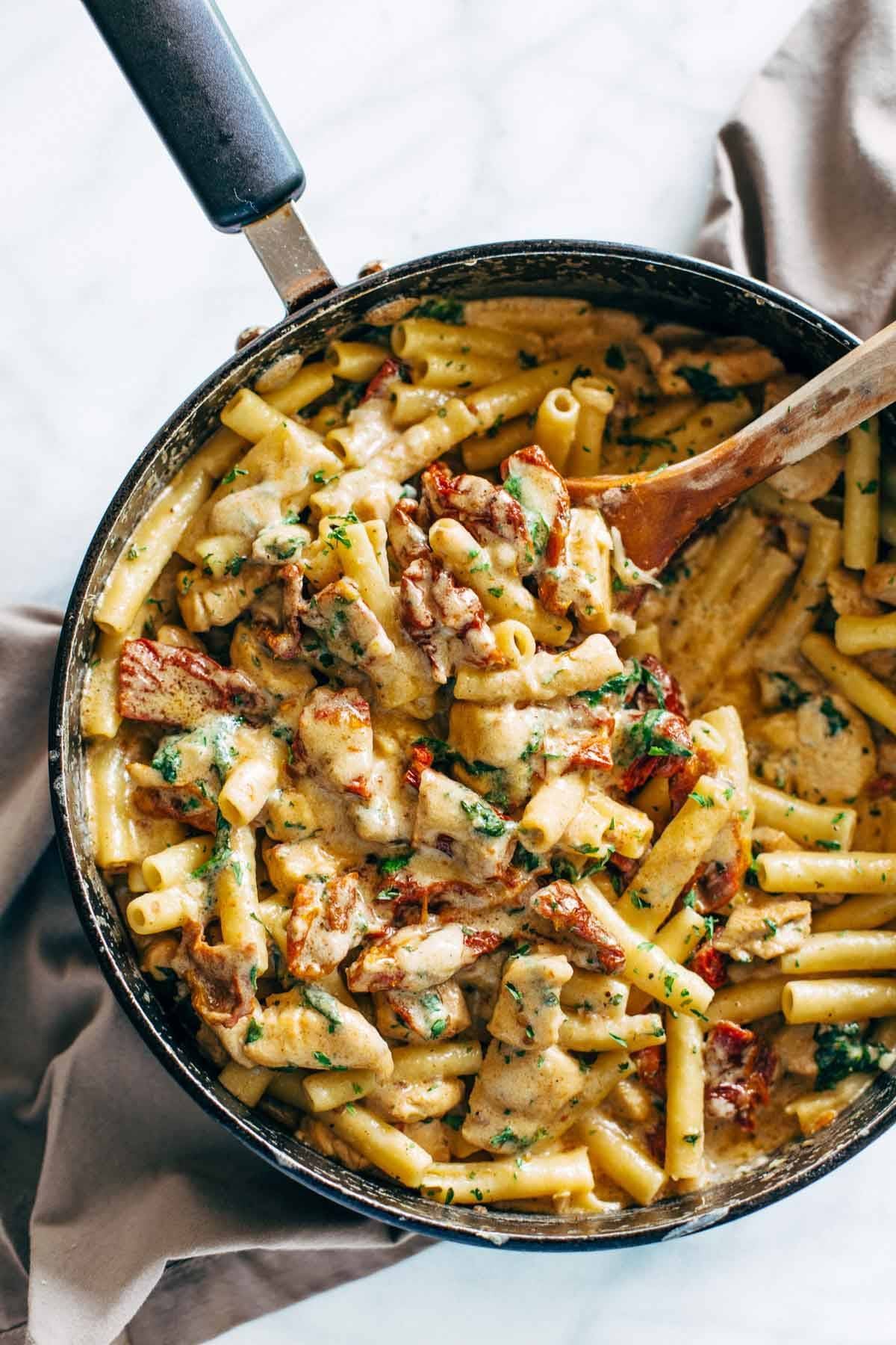 Sun Dried Tomato Chicken Florentine Pasta - a 30 minute recipe with a sun dried tomato cream sauce, chicken, ziti, and Mozzarella cheese. | pinchofyum.com
