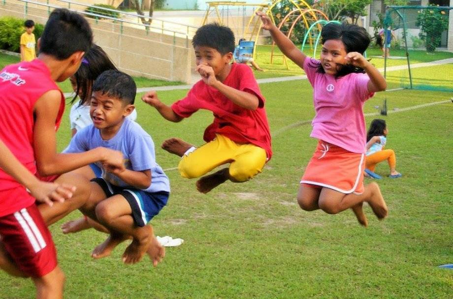 Children playing games outside.